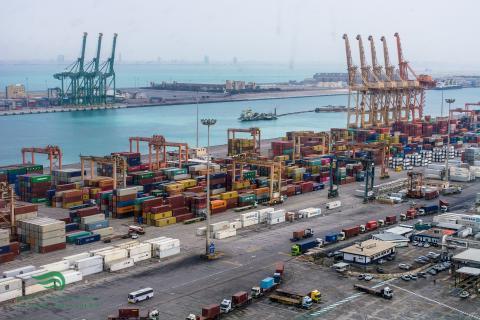 Aerial view of a container port with cranes